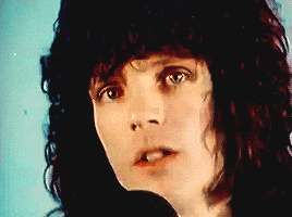 a close up of a person 's face with a microphone