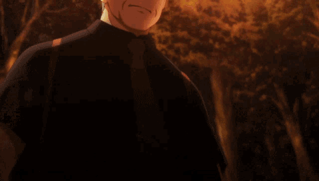 a man in a black shirt and red tie is standing in a forest