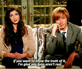 a man and a woman are sitting next to each other and the man is saying if you want to know the truth of it