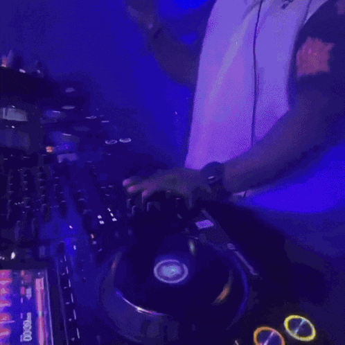 a blurred image of a dj playing music with a screen that says dj