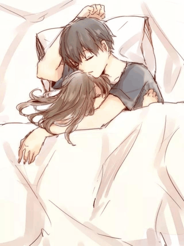 a boy and a girl are sleeping in a bed