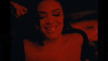 a close up of a woman with her tongue out