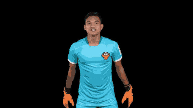 a soccer player wearing a blue shirt with a lion logo on the front