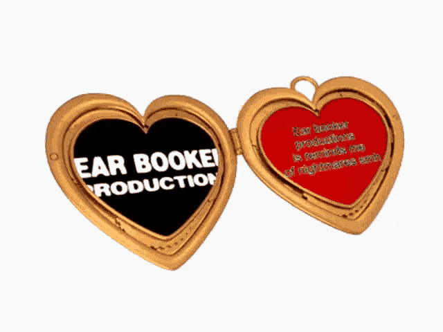a heart shaped locket with the words ear bookei production on it