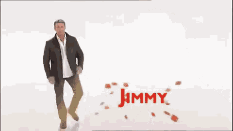 a man in a suit is standing in front of the name jimmy tom