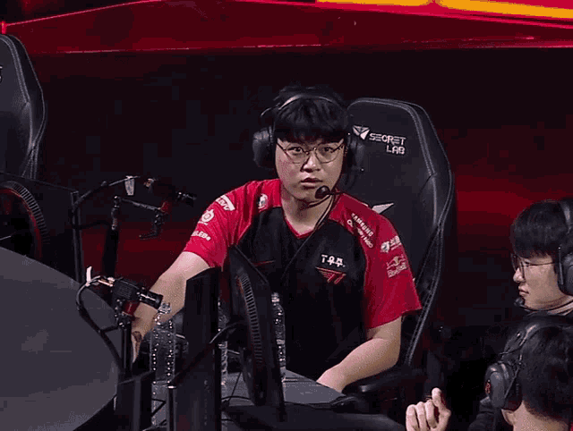 a man wearing headphones and a black shirt with the number 7 on it