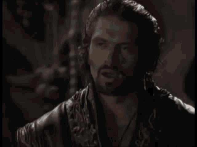 a man with a beard and a leather jacket says i want out
