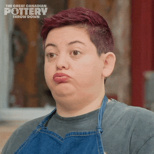 a woman making a funny face with the great canadian pottery throw down in the background