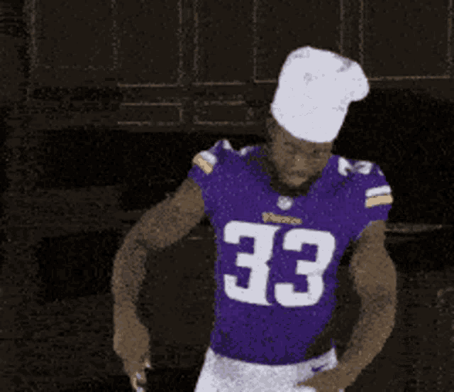a football player with the number 33 on his jersey