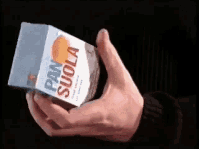 a person is holding a box of pan suola