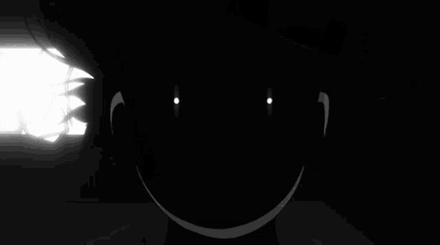 a silhouette of a person 's face with glowing eyes .