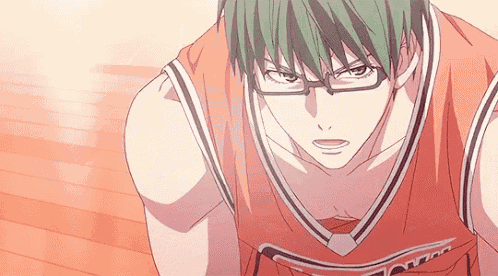 a basketball player with green hair and glasses is kneeling on the floor .