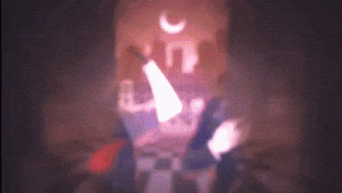 a blurry picture of a person with a crescent moon in the background