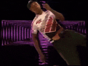a blurry image of a person 's face against a green and purple pattern
