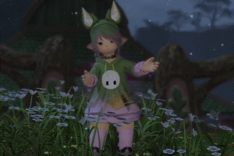 a girl in a bunny costume is standing in the grass