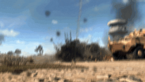 a blurry picture of a tower and a truck