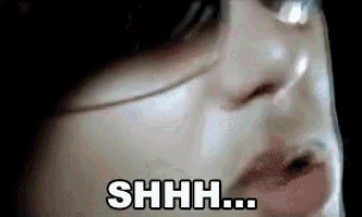a close up of a woman 's face with the words " shhh " above it