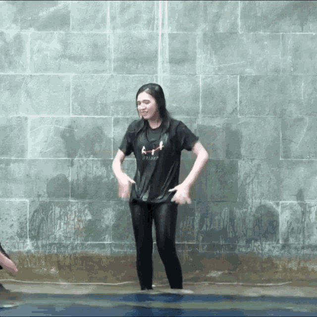 a woman wearing a wet shirt that says ' i love you ' on it