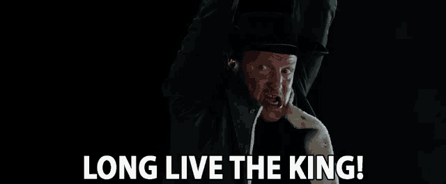 a man in a top hat is saying long live the king .
