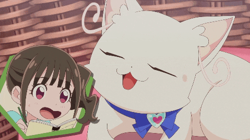 a girl is reading a book next to a white cat with a heart on its neck