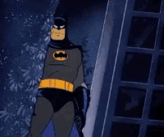 a cartoon of batman standing next to a building