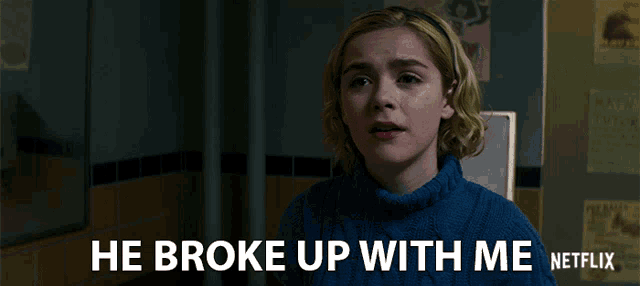 a woman in a blue sweater with the words he broke up with me netflix on the bottom