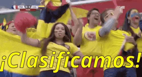 a group of people are cheering in a stadium and they are wearing yellow shirts that say clasificamos !