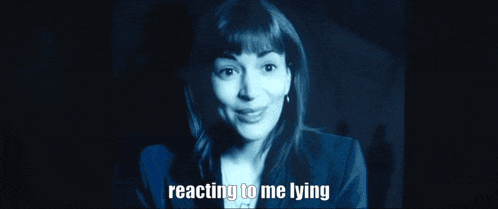 a close up of a woman 's face with the words reacting to me lying next to her