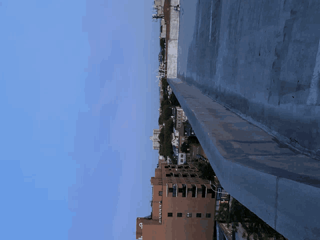 a view of a city from the top of a building that says ' a & m ' on the side