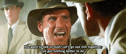 a man in a cowboy hat is talking to another man .