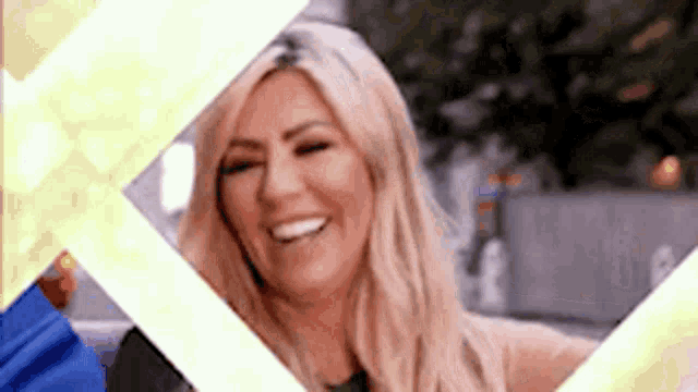a close up of a woman smiling in a picture frame .