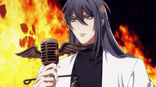 a man with long hair is holding a microphone with angel wings and the numbers 11-30 on it