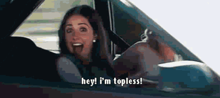 a woman is driving a car and says hey ! i 'm topless !