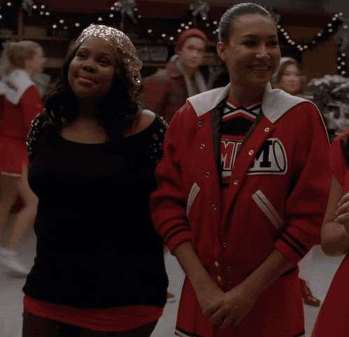 two cheerleaders are standing next to each other with the words produced by robert del valle