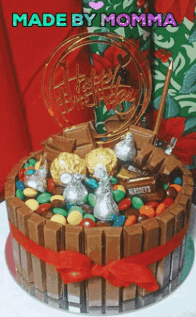 a birthday cake made by momma with hershey 's candy on top