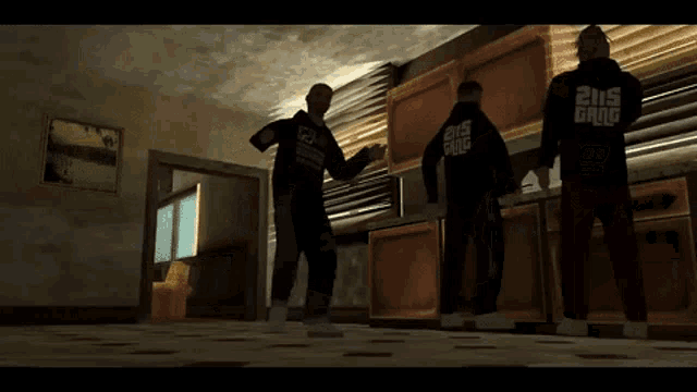 a man in a 205 gang hoodie stands in a room