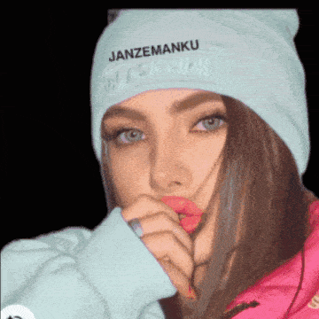 a girl wearing a beanie that says black pink