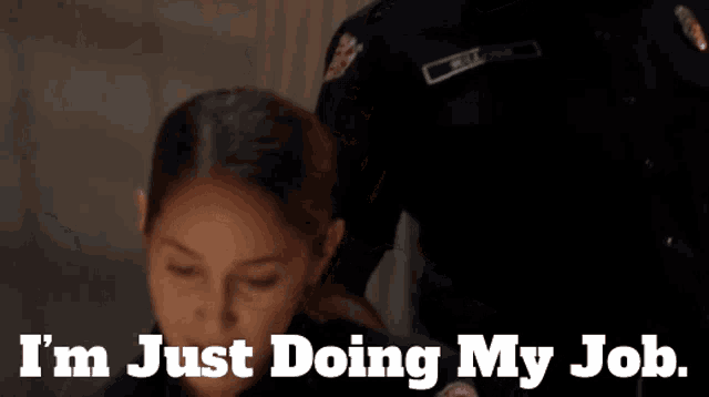 a woman says i 'm just doing my job in front of a police officer