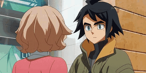 a boy and a girl are looking at each other in front of a sign that says control