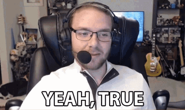 a man wearing glasses and a headset says yeah true