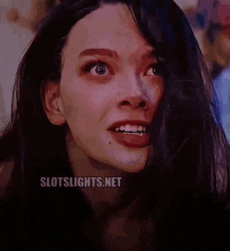 a close up of a woman 's face with slotslights.net written on the bottom right
