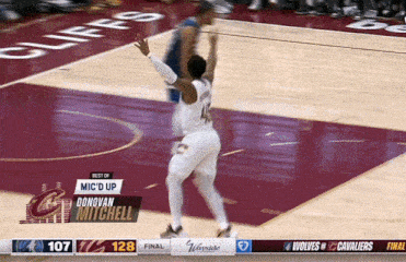 a basketball player named donovan mitchell is jumping for a shot