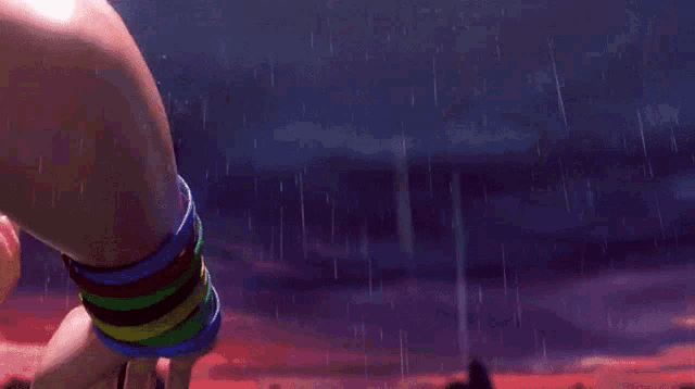 a woman 's arm is splashed with water while wearing bracelets that say ' i love you '