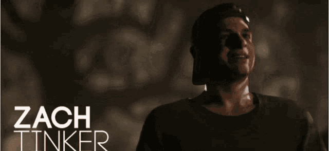 a poster for zach tinker shows a man in the dark