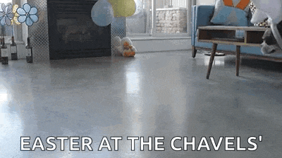 a living room with a fireplace and balloons and the words `` easter at the chavels '' written on the floor