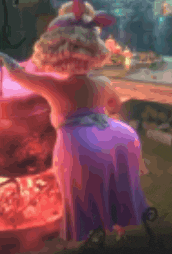 a girl in a purple dress is standing in front of a fire pit