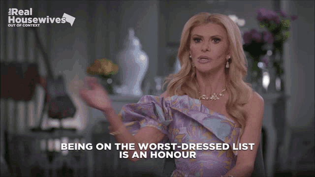a woman in a purple dress talks about being on the worst dressed list