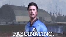a man in a blue shirt is standing in front of a building with the words fascinating on it