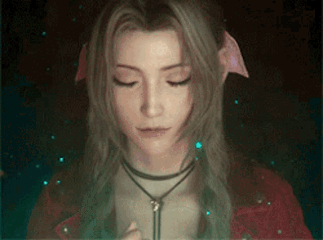 a close up of a woman with her eyes closed wearing a red jacket and a necklace