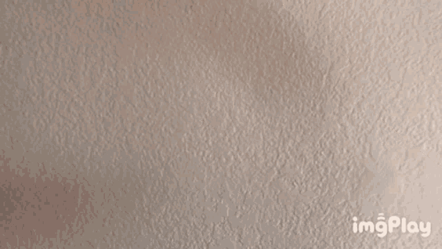 a close up of a person 's hand pointing down